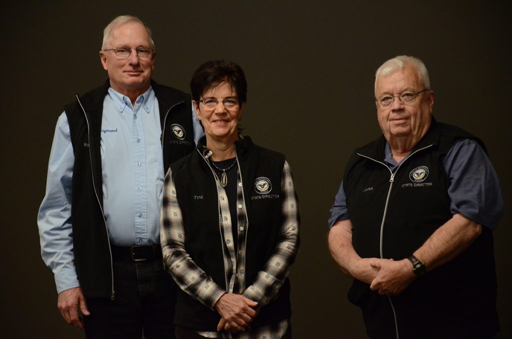 Illinois State Directors Raymond and Tina Odle (left) and Missouri State Director John Leinberger (right) received 15 Year jackets for their service to the CMP.