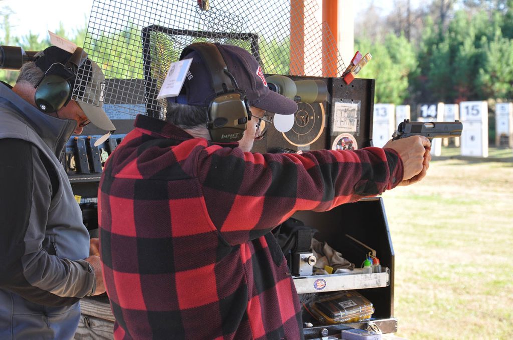 Eric Herrin aiming pistol