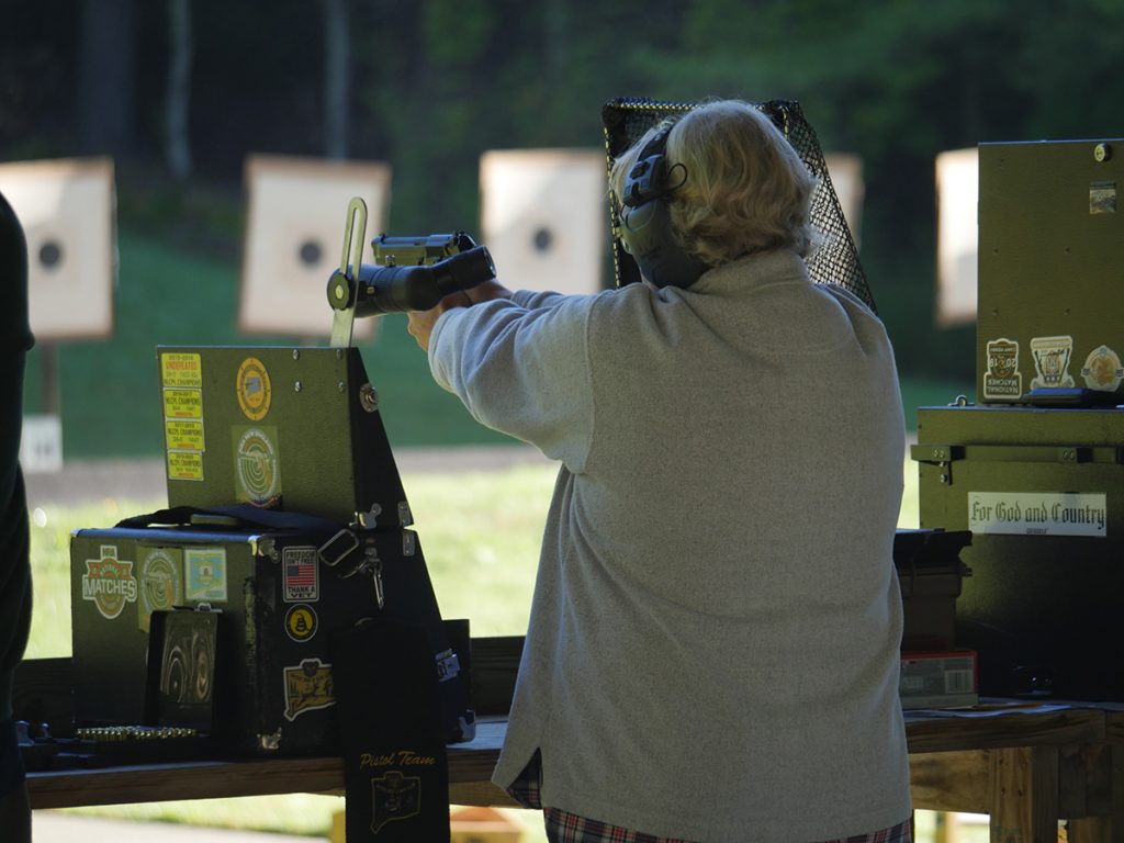 Pistol competitor aiming downrange