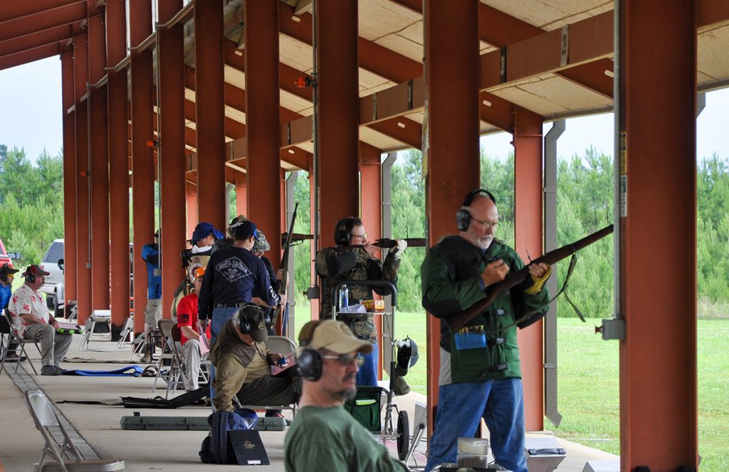 Rifle competitors on the firing line at the CMP Talladega Marksmanship Park.