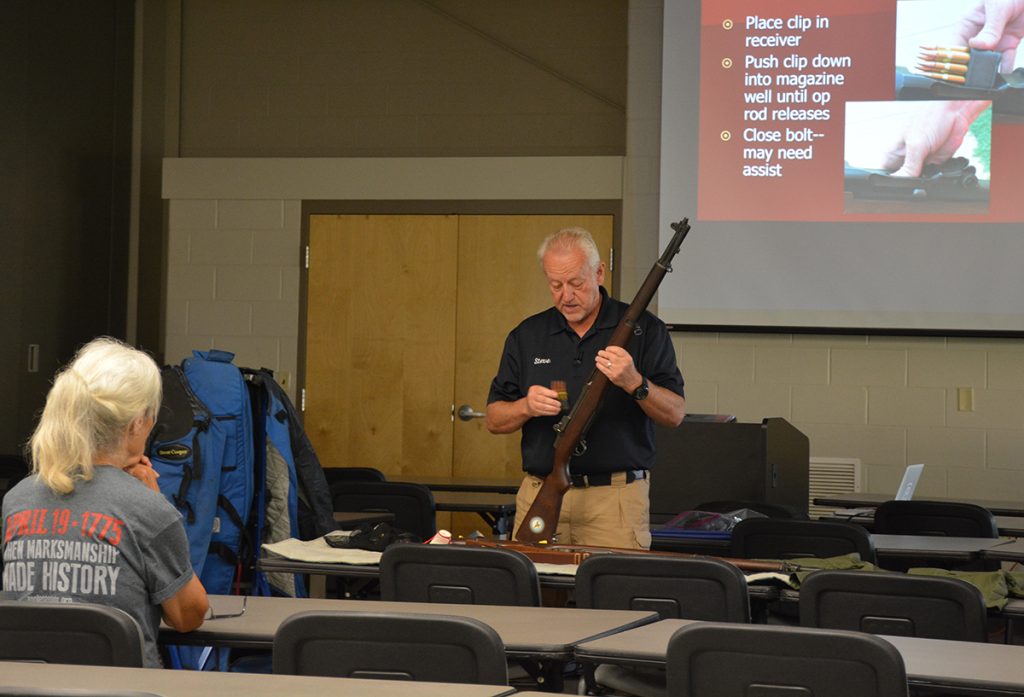 CMP Instructor demonstrating loading an M1 Garand rifle.