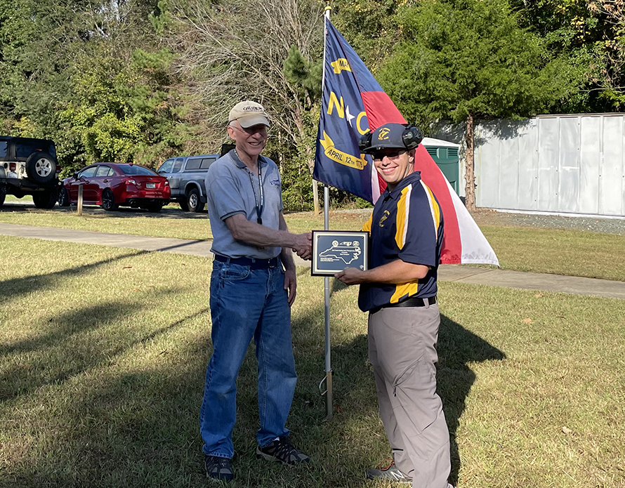 Nate pictured with award plaque 