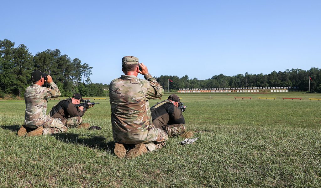 SFC Deal firing in the sitting position with the Army Marksmanship Unit.