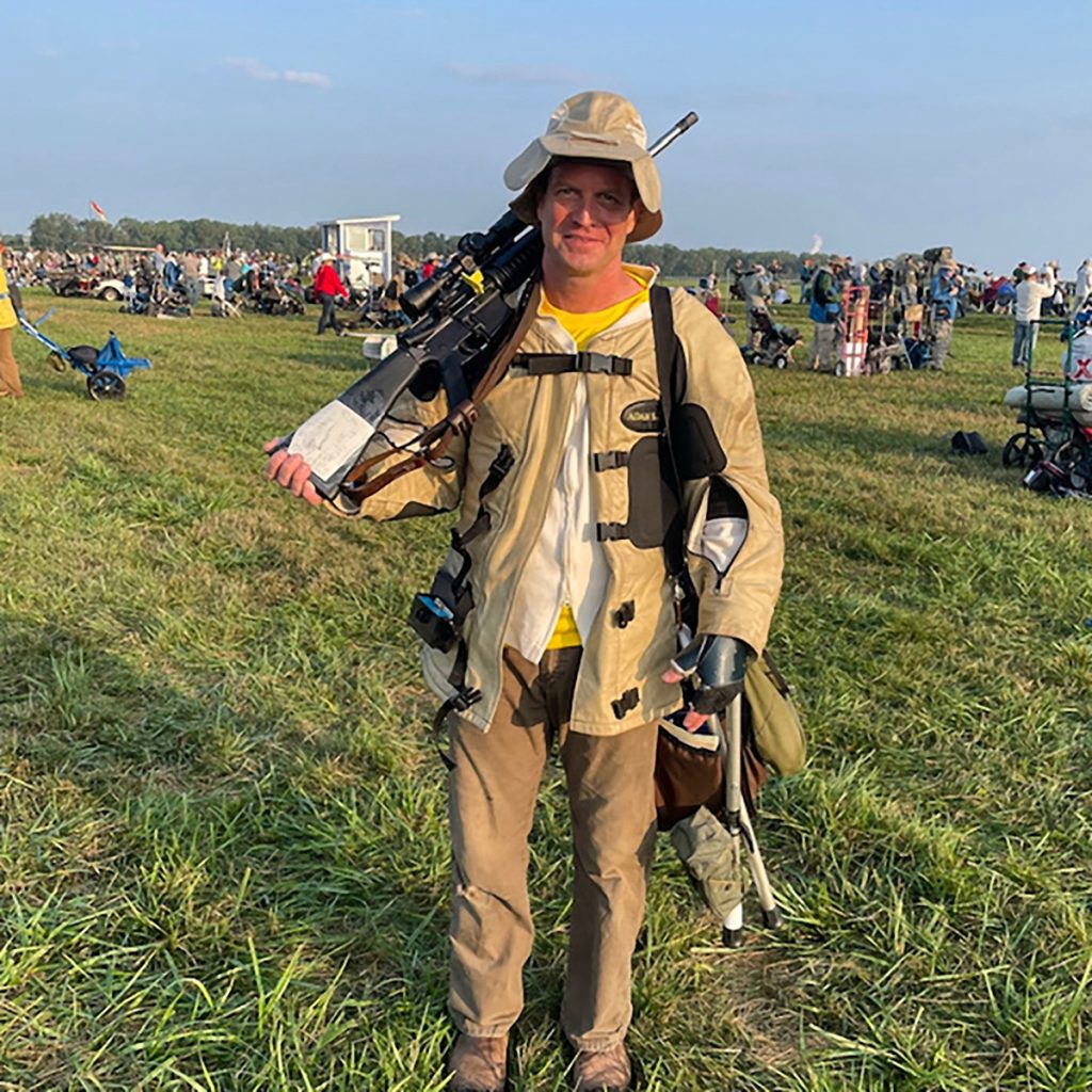 Competitor posing with rifle on Camp Perry ranges.