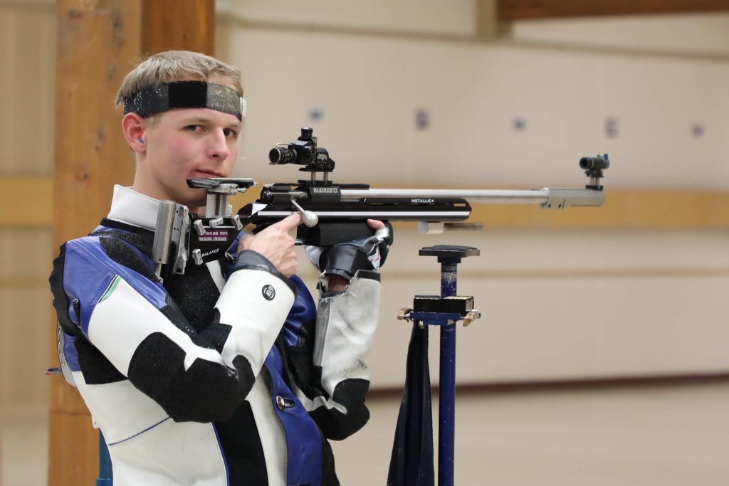 Spc Roe pointing rifle downrange.