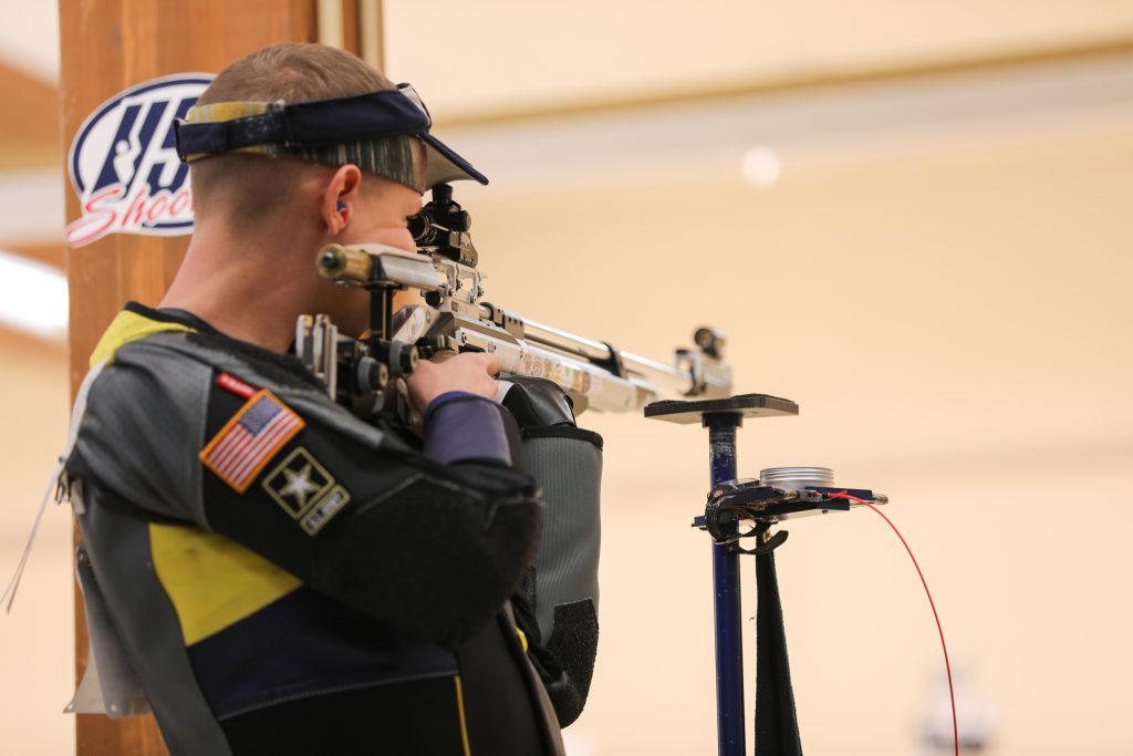 Spc Roe firing rifle in standing position.