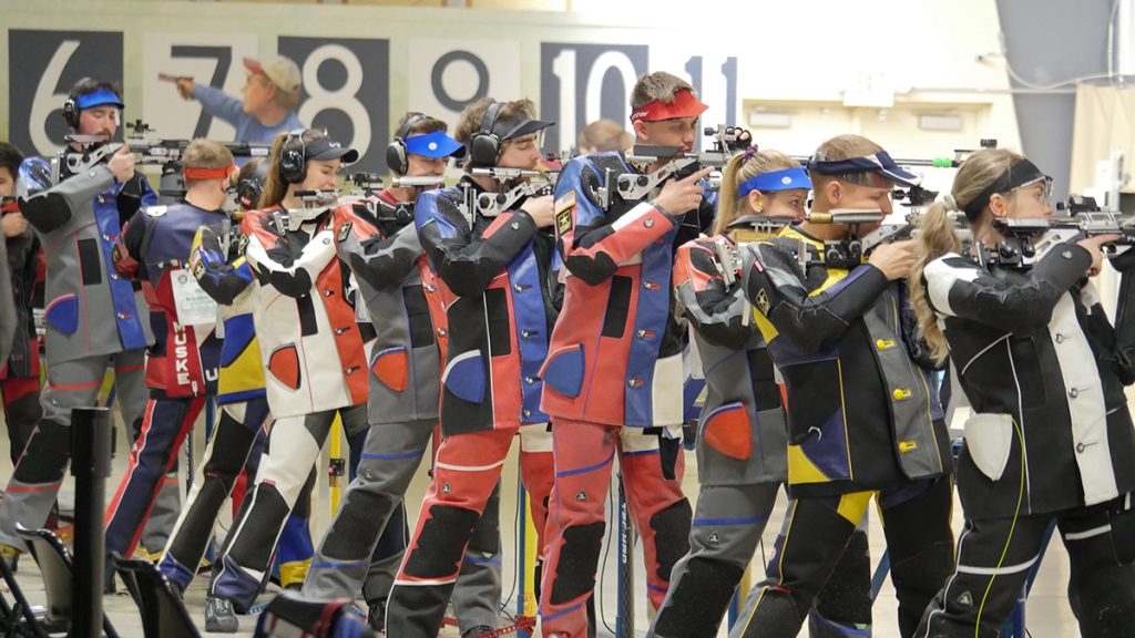 Air rifle competitors on the firing line.