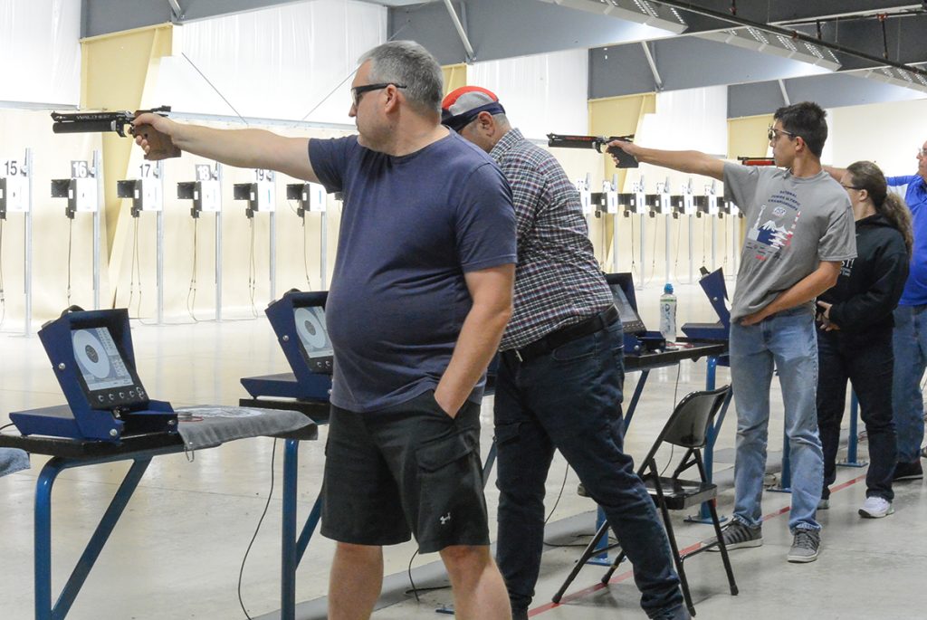 Pistol competitors on the firing line.