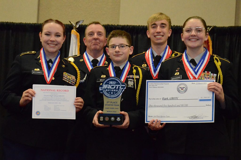 Ozark High School with trophy and national record