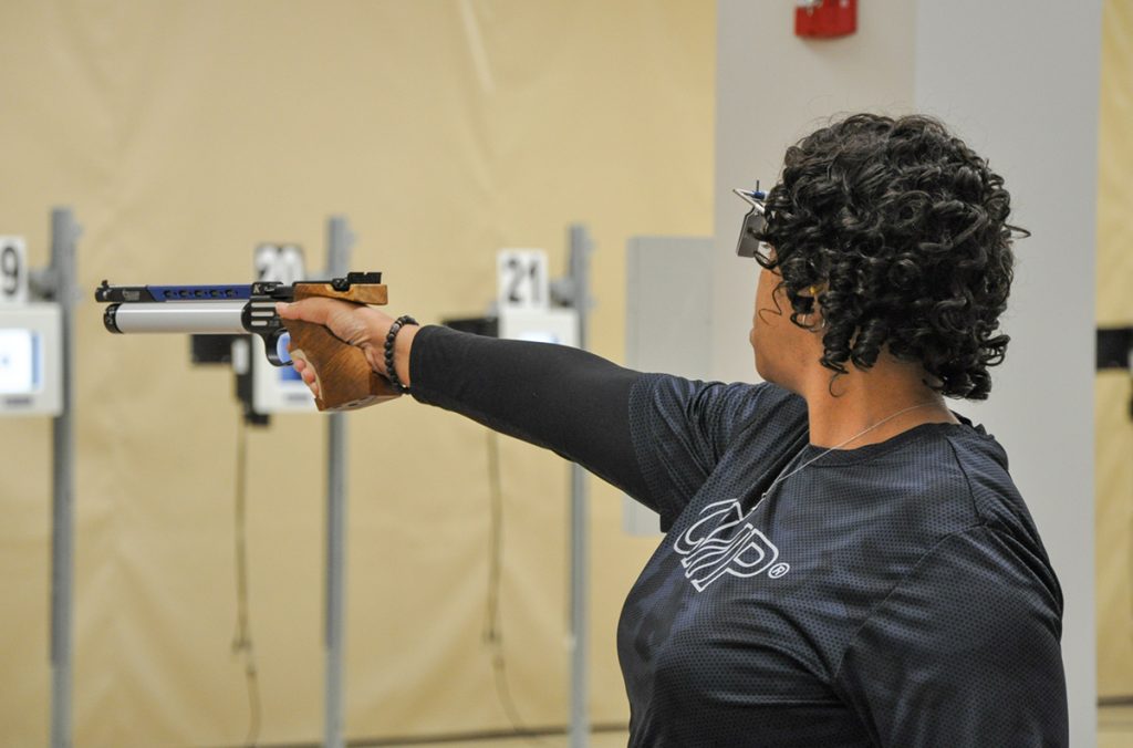 Renay firing pistol