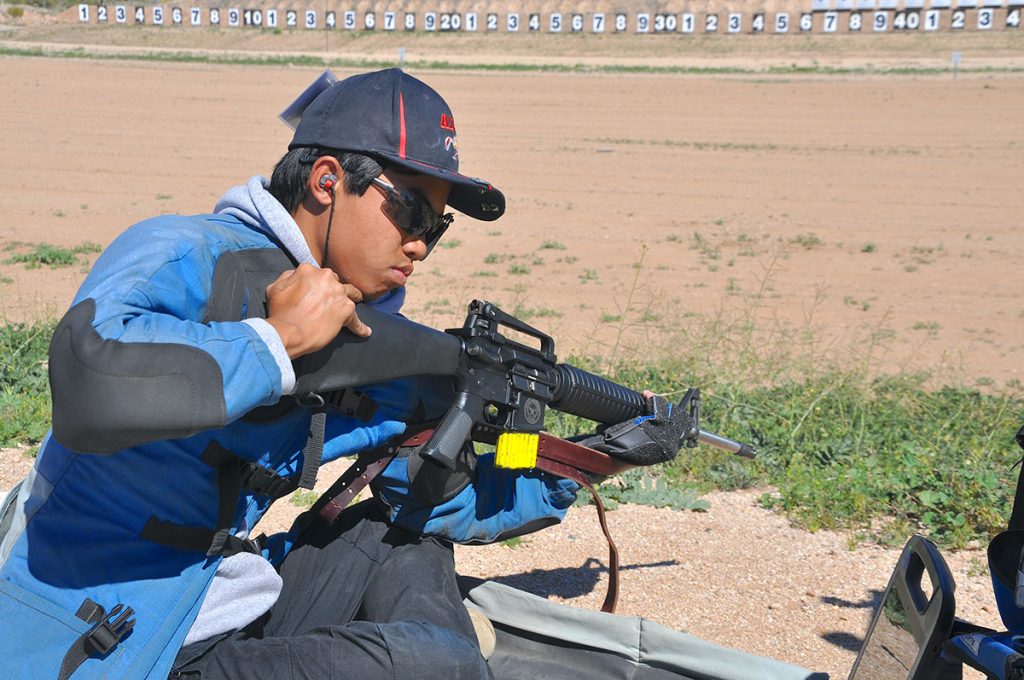 Competitor in sitting position with rifle 