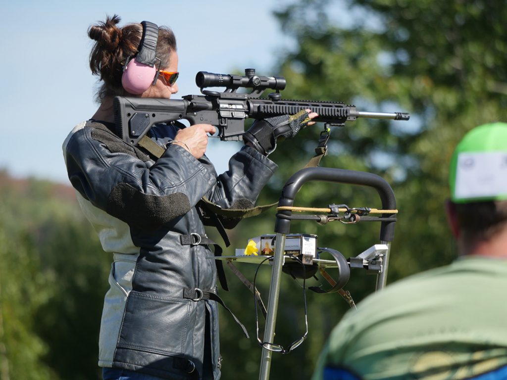 Competitor firing high-power rifle in standing