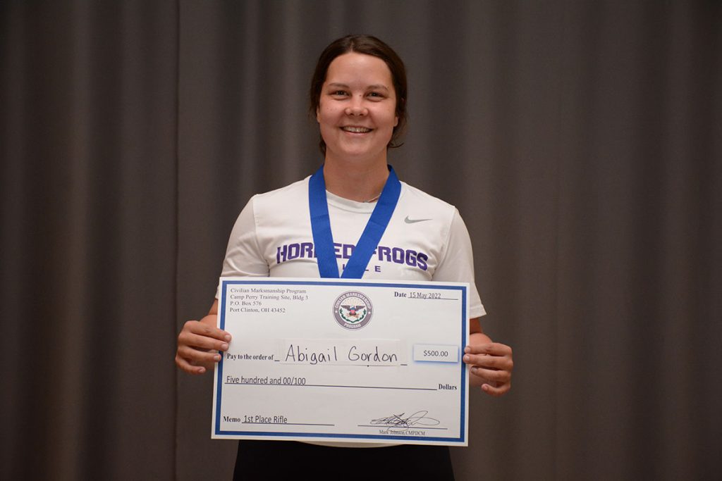 Abigail Gordon with the $500 check from CMP for winning the 60 shot open rifle match