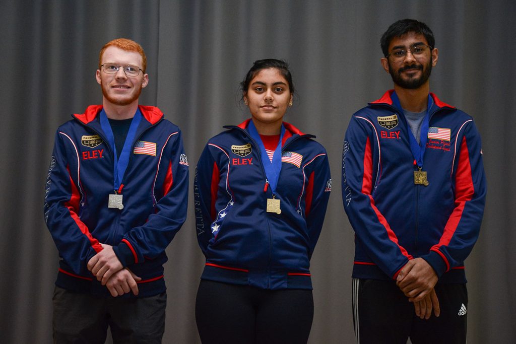 Leading pistol juniors with medals