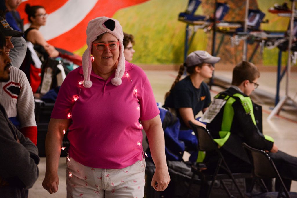 CMP staff member Jackie wears a pink flamingo hat and lights during the Super Final