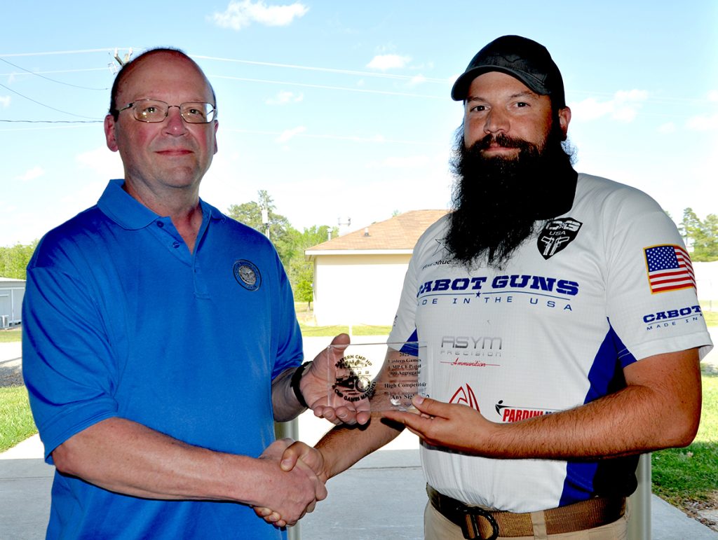 Jonathan Shue with his award