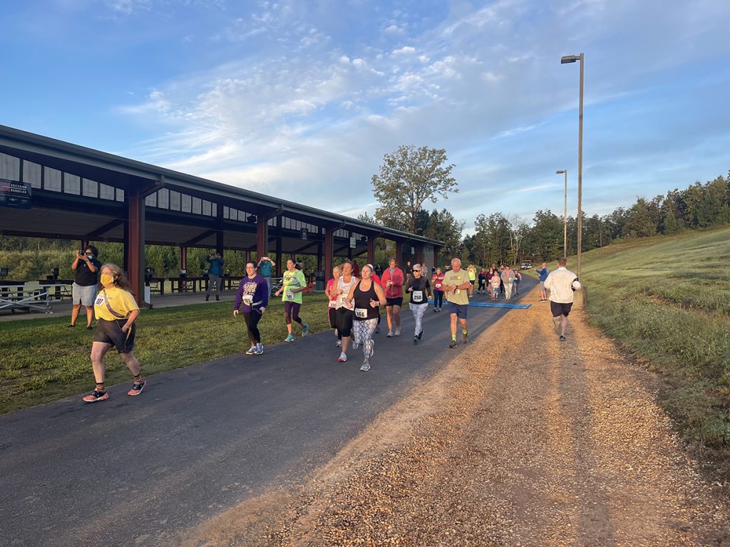 Runners participating in the CMP's 5K at the Talladega Marksmanship Park.