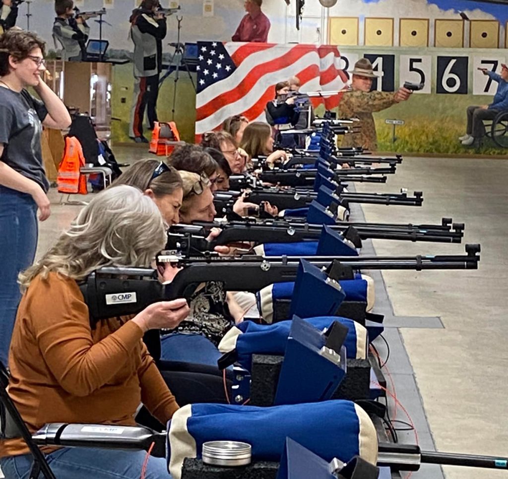 Group of ladies shooting downrange.