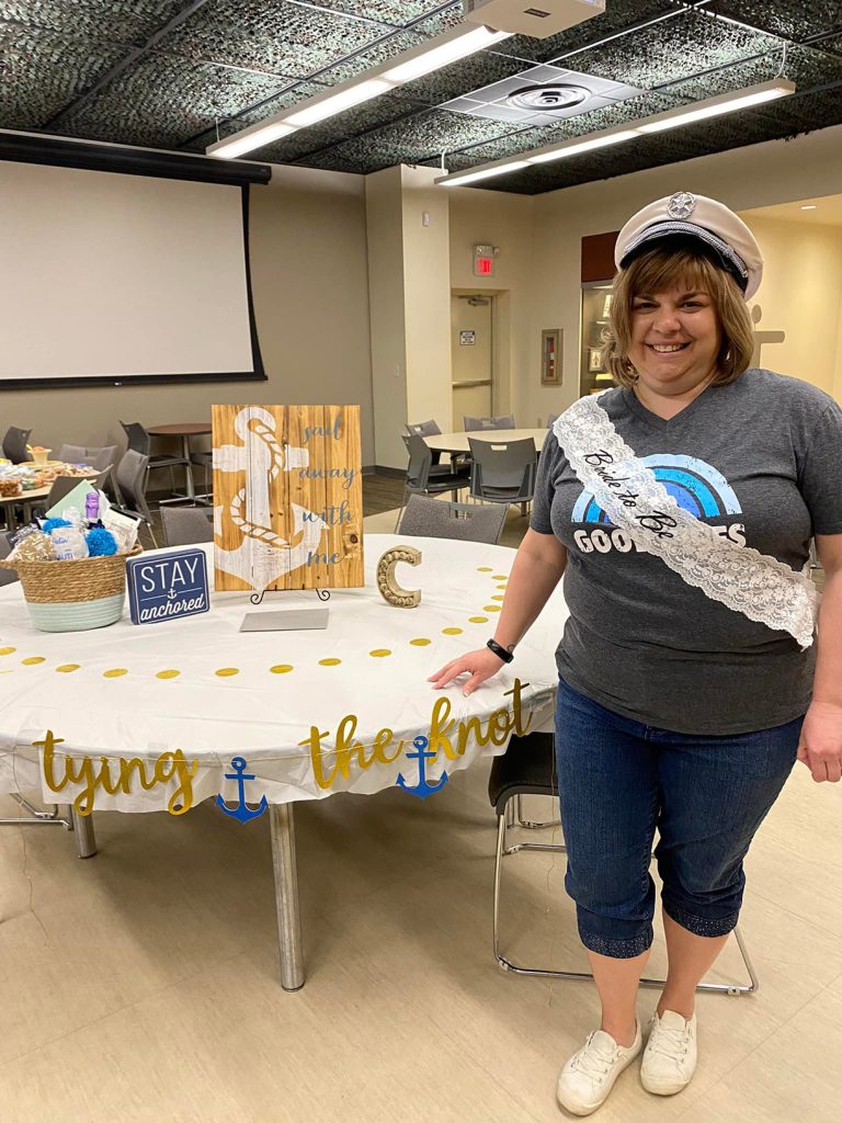 Mary Ann Snider poses with decorations.