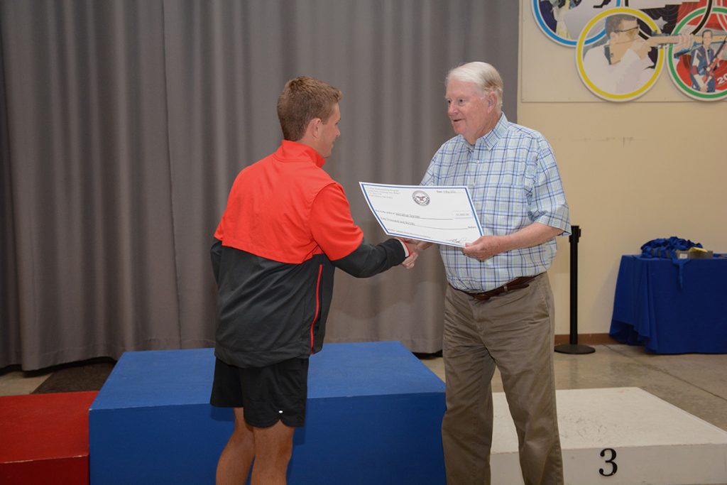 Johnathan receives the CMP Scholarship check from DCME Gary Anderson.