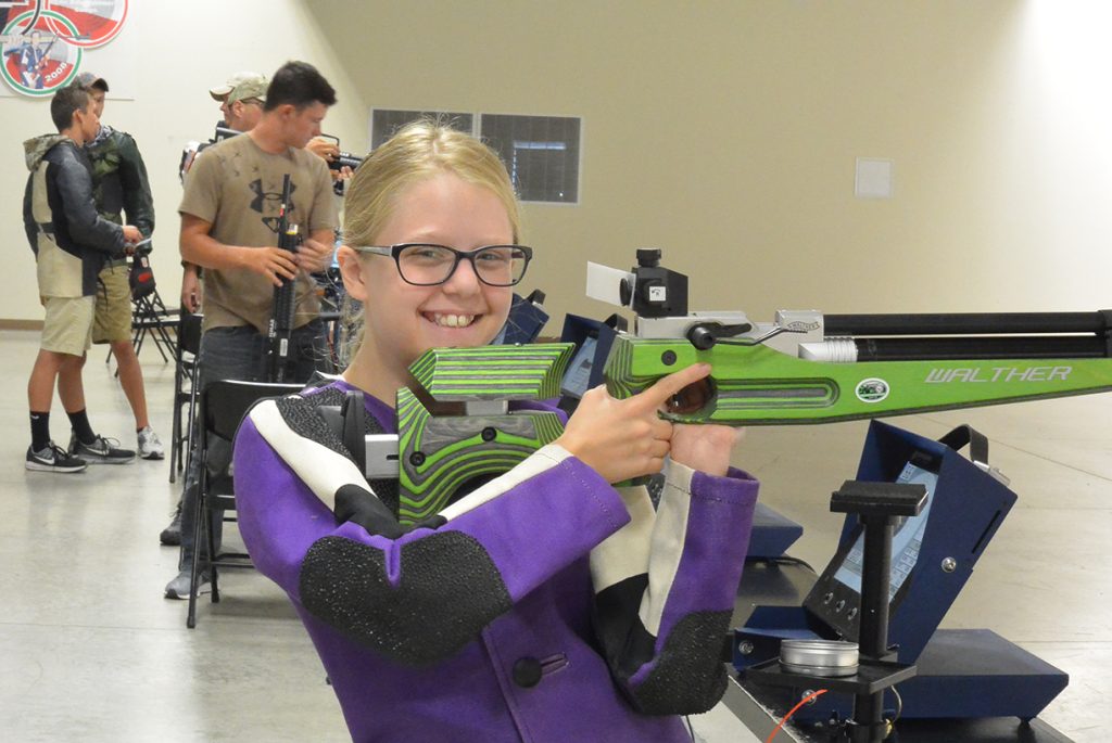 Claudia smiles between shots during her training.