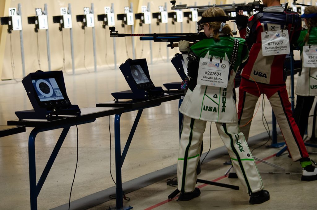 Claudia firing in standing during the match.