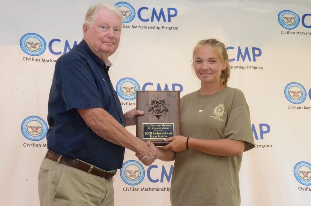 Madelyn receives the High Junior plaque during the CMP awards ceremony.