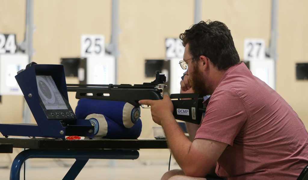 A competitor using a supported position off the bench.