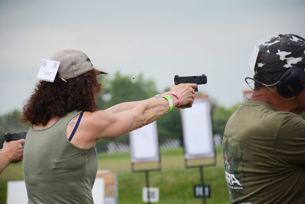 Woman takes a shot during the Glock GSSF National Challenge Match.