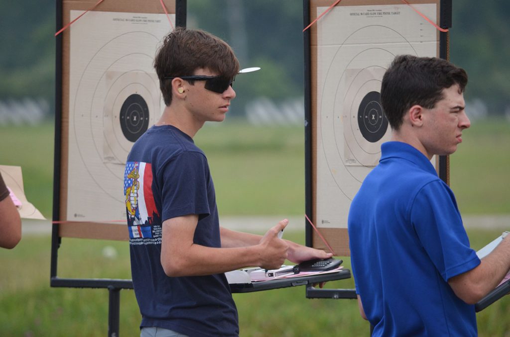 Caleb participating in the pistol Small Arms Firing School.
