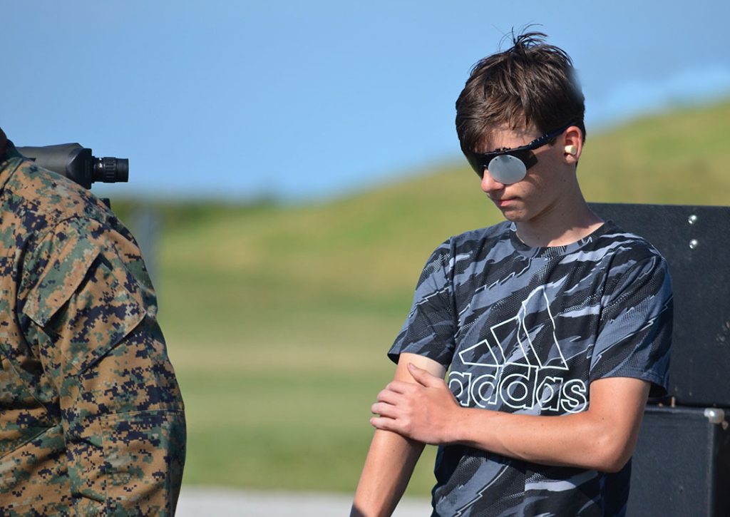 Caleb standing on the firing line in between shots during a National Matches pistol competition.