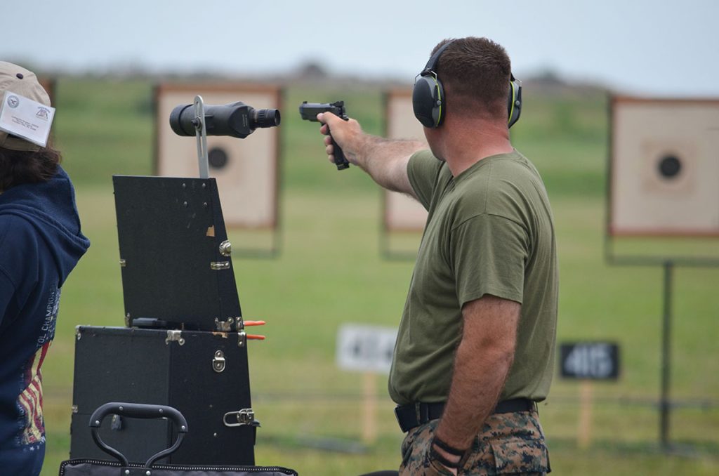 Nick aims a pistol downrange during the 2022 National Matches.