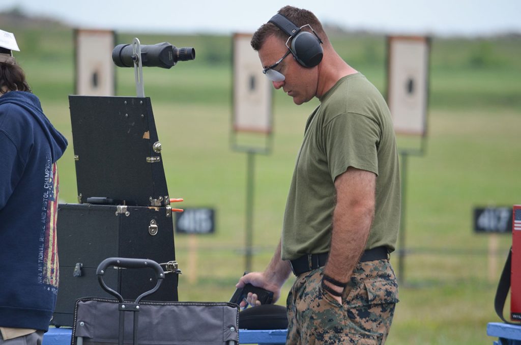 Nick standing on the firing line during a pistol event in the 2022 National Matches.