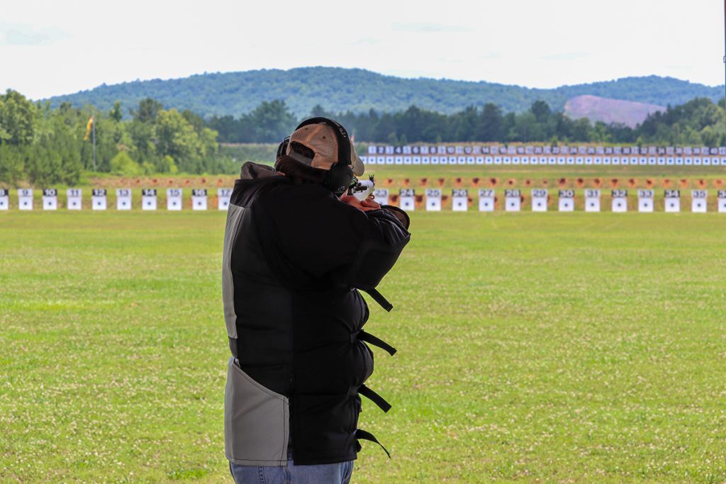 A man aims a rifle downrange on the 600-yard range