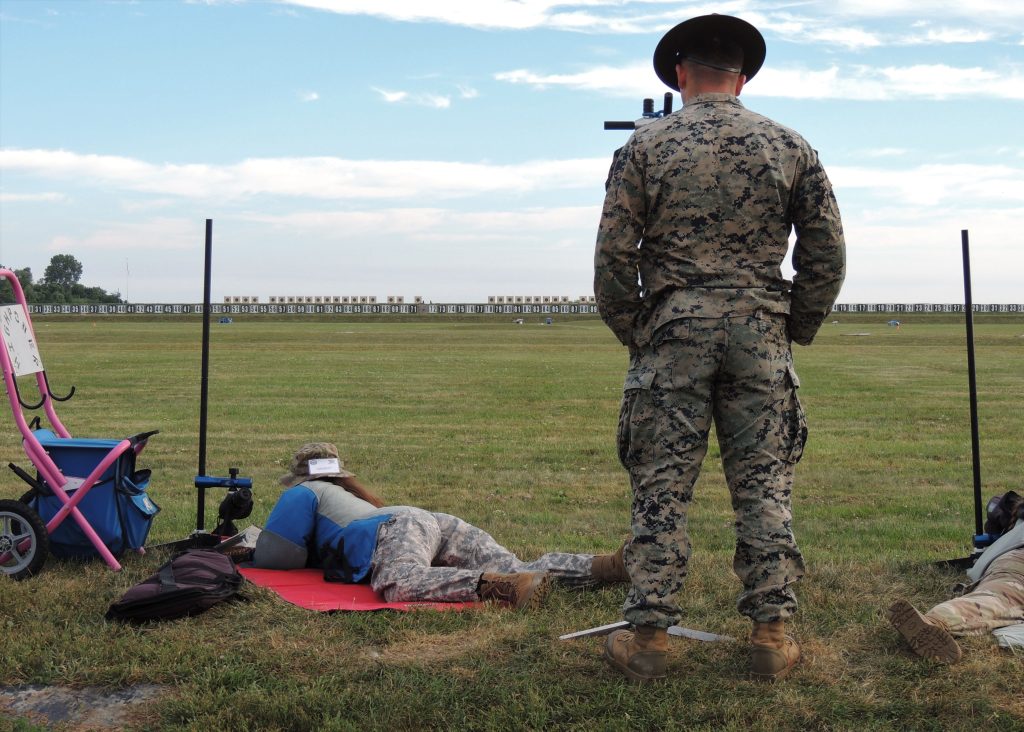 Nick instructing an athlete during the U.S. Marine Corps Junior Rifle Camp. 