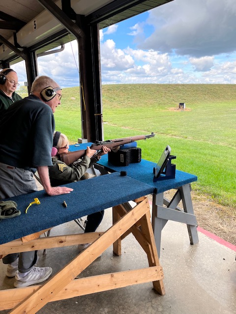 Stephanie Vanderwilt shooting a rifle off the bench