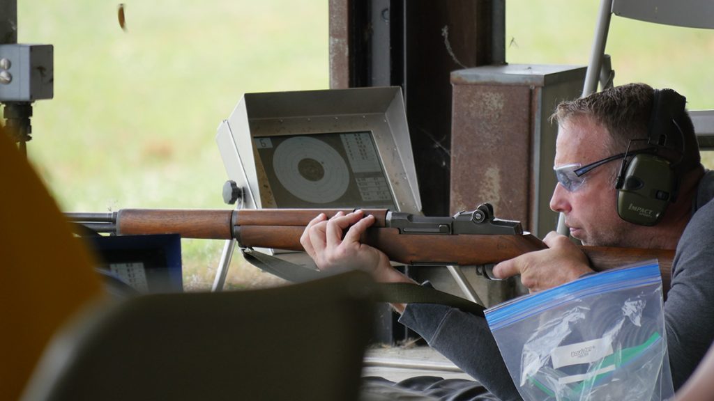 A competitor firing a rifle in the prone position.