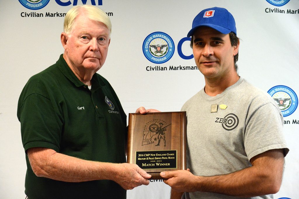 David receives an award plaque at the New England Games.