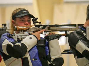 Katrina Demerle with her air rifle in the standing position.