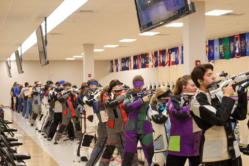 Air pistol and air rifle athletes on the firing line.