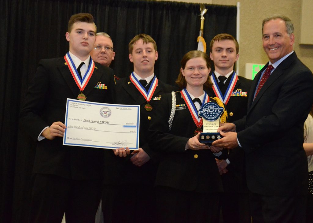 Gerald O'Keefe presenting Floyd Central NJROTC with a 5th place precision team trophy.