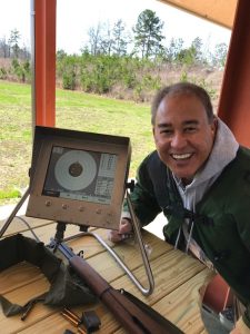 Will Datnzler with an electronic target monitor on the range. 