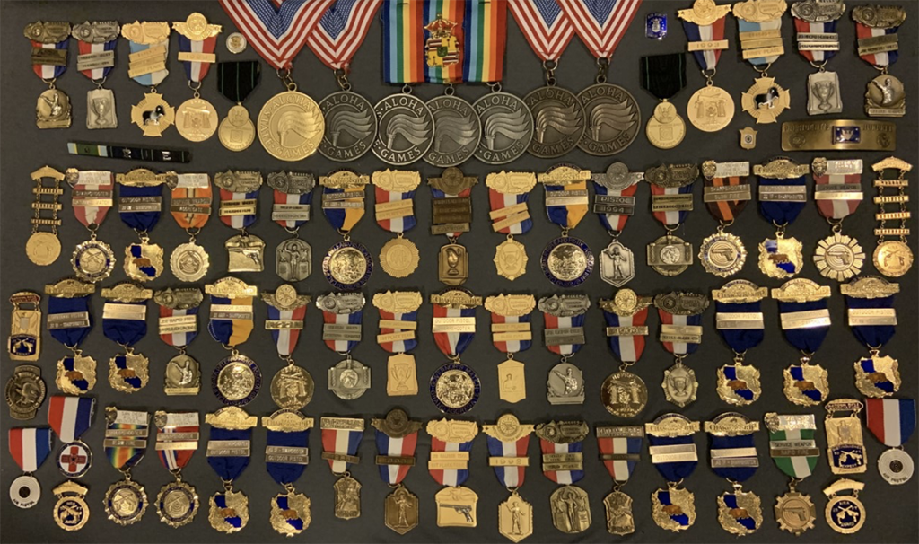 Doc Engelmeier's medal collection, featuring over 70 medals.