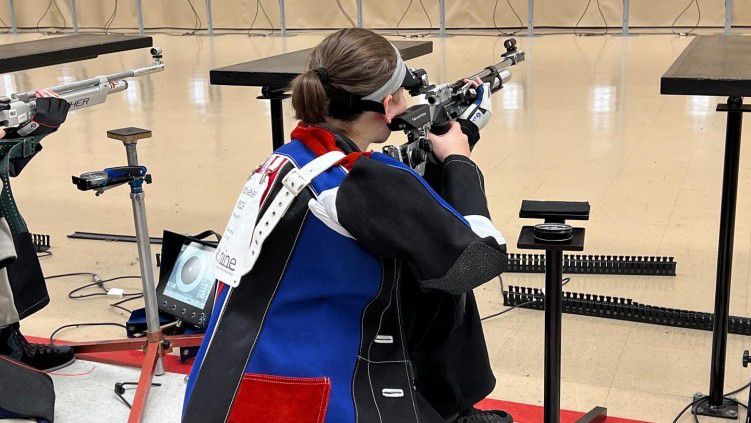 Debi on the range in the kneeling position.