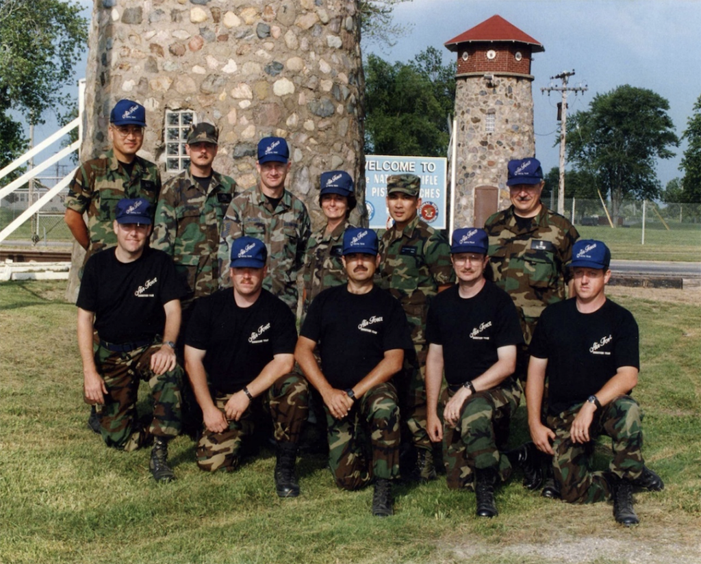 The 1994 USAF National Pistol Team posing by the towers at Camp Perry.