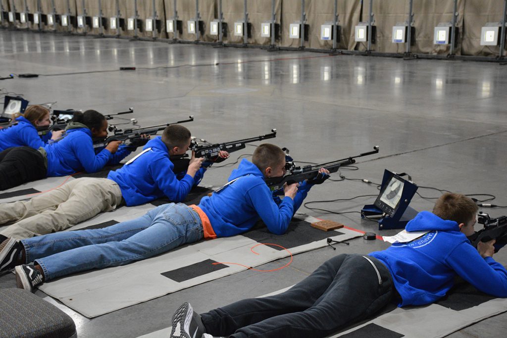 Junior Air Rifle competitors firing in the prone position.