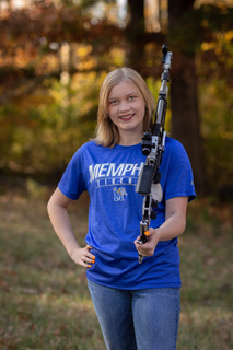 Kenlee with rifle and Memphis t-shirt.