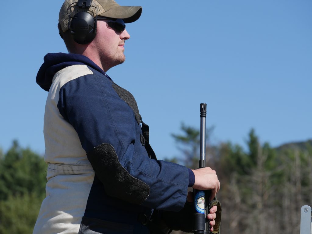 Chris Knott with rifle on the firing line.