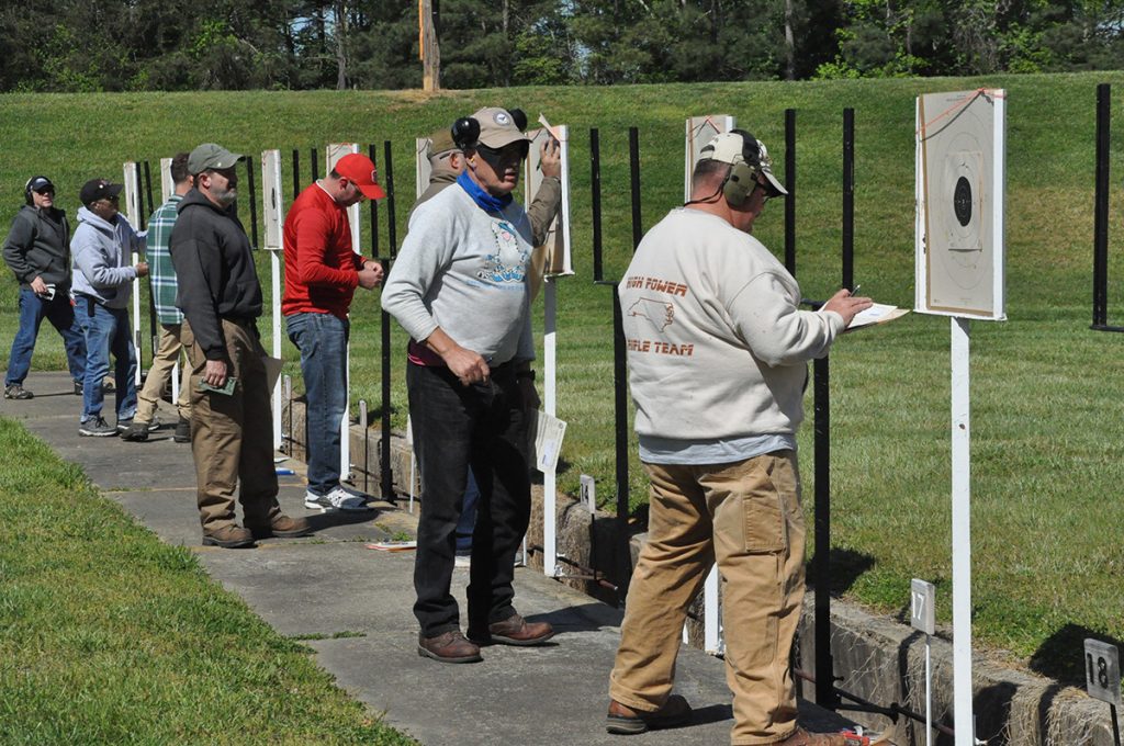 Competitors scoring their targets.