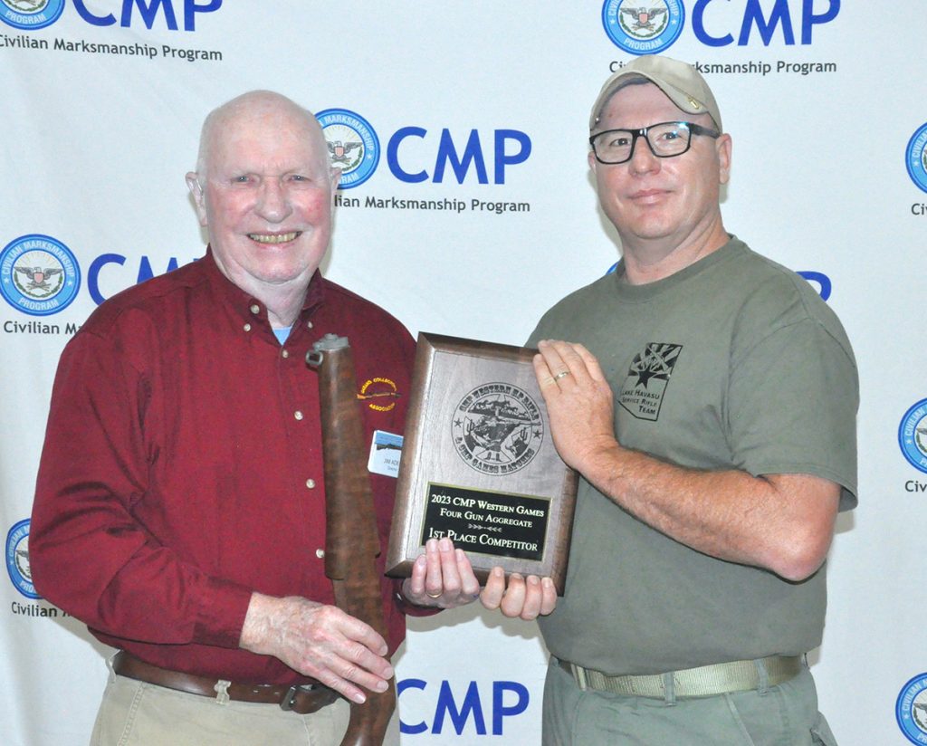 Dennis Caviness with the Four Gun Aggregate award plaque